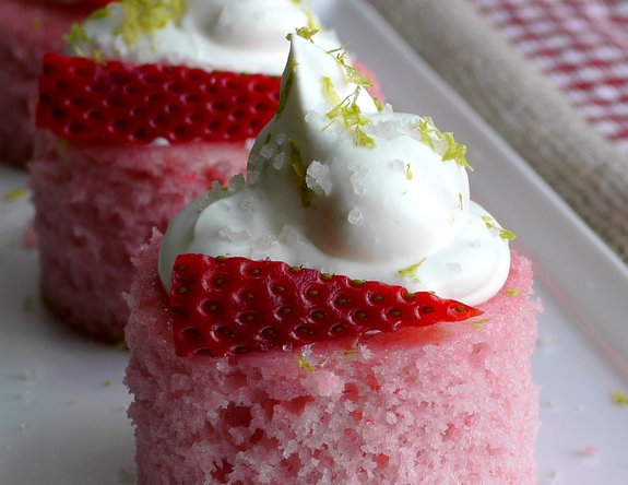 VIDEO + RECIPE: A Daiquiri mixer and tequila give these Strawberry Margarita Cakes Bites their namesake. The lime zested whipped cream flecked with sea salt is reminiscent of a salted rim on a margarita glass from NoblePig.com #noblepig #Boozydessert #margarita #strawberrydessert #strawberry