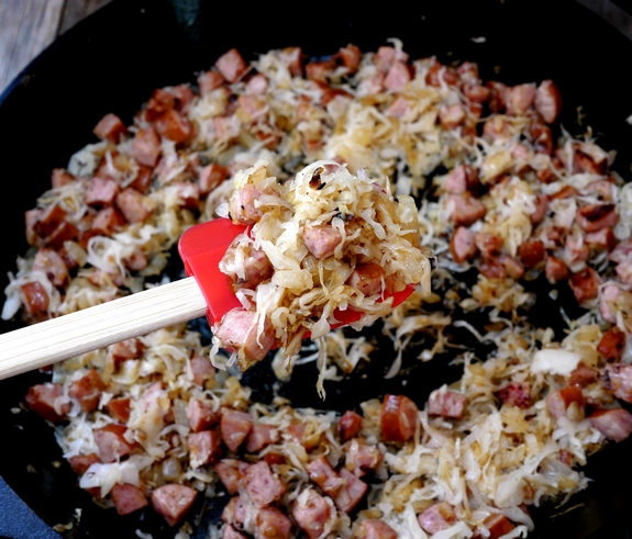 Sauerkraut and Kielbasa Nachos peeking in the pan