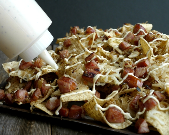 Sauerkraut and Kielbasa Nachos with Cracked Pepper Dijon Cream