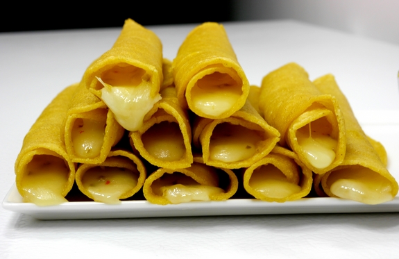 Smokey Soft Taco Roll Ups with Avocado Garlic Dipping Sauce a stack of goodness