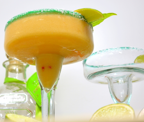 This stone cold, top shelf frozen margarita recipe using frozen nectarines is one for the books. Nectarine-Basil Frozen Margaritas are going to be your new favorite. Nectarine Basil Margarita in a glass.