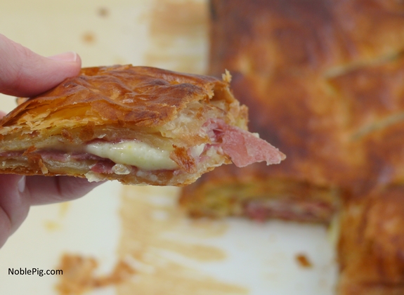 Prosciutto Fontina Stuffed Puff Pastry take a bite