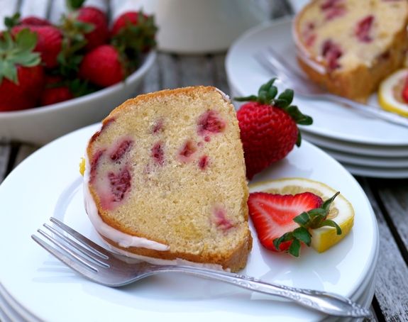 VIDEO + RECIPE: This from scratch Strawberry Lemon Cream Cheese Pound Cake is a deliciously rich cake that is not overly sweet. I've incorporated cream cheese, which is unusual for pound cake. The cream cheese gives the cake a springy crumb texture, richness and tenderness, while keeping the cake moist for several days. It is the perfect choice for strawberry season and beyond from NoblePig.com. #noblepig #poundcake #strawberrycake #cake #lemoncake