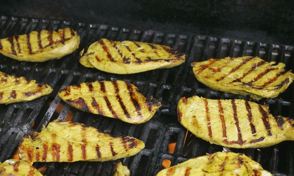 Grilled Turmeric Lemon and Lime Chicken on the grill