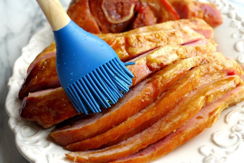 This Baked Ham with Rum and Coke Glaze steals the holiday spotlight with its sweet and savory glaze, a distinctive twist that's always a crowd-pleaser. The bold combination of rum and Coke, elevates the juicy, tender ham and makes every bite unforgettable. slicing baked ham