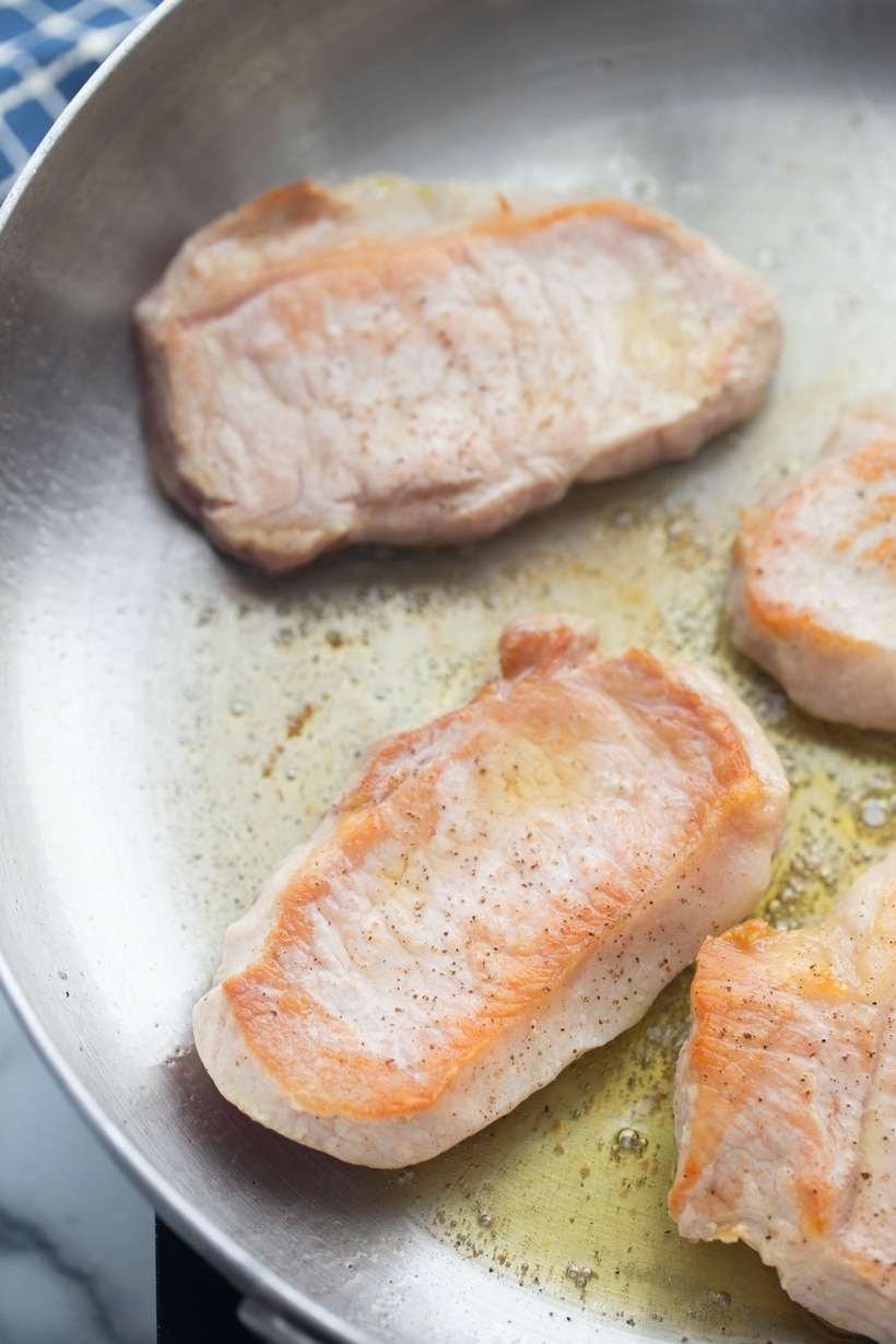 boneless pork chops in a skillet