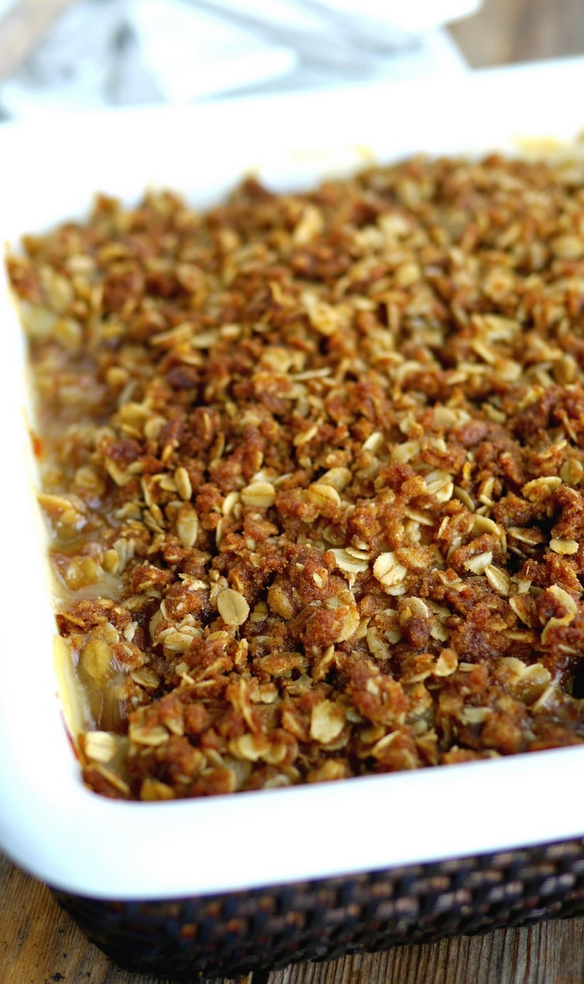 A classic pairing of pears and ginger makes this Pear and Ginger Crumble recipe a dessert you will not soon forget. Serve warm right out of the oven with a scoop of vanilla ice cream for the ultimate treat. Easy enough to make on a weeknight too. Pear and ginger crumble in a dish.