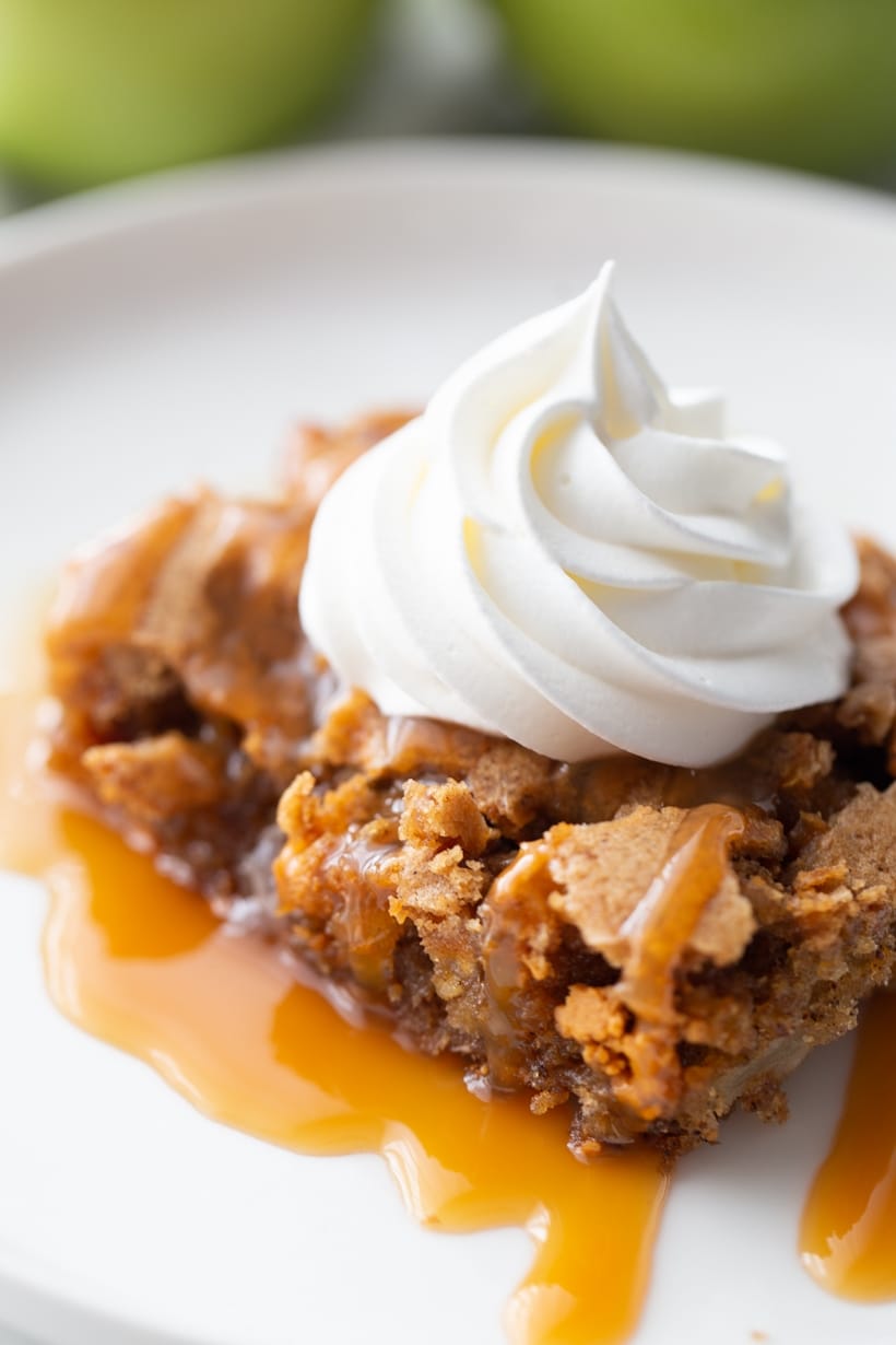 Butterscotch Apple Cake is light and airy, with fresh apple chunks and sweet butterscotch morsels baked into every bite. Finished with caramel and whipped cream, it adds a layer of decadence that completes the dessert perfectly. butterscotch apple cake