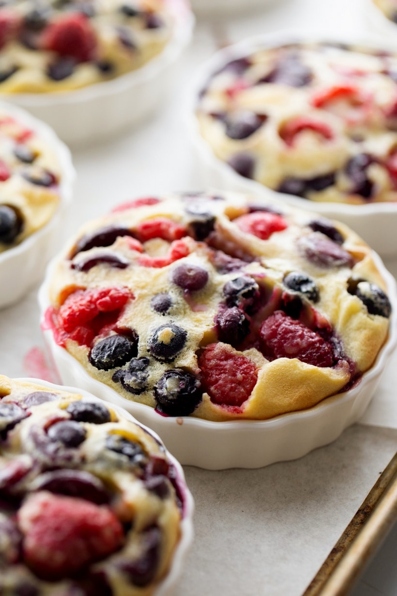 Enjoy the taste of summer with this mixed berry and cherry clafoutis. This dessert features ripe cherries and berries baked into a creamy custard. mixed berry and cherry clafoutis