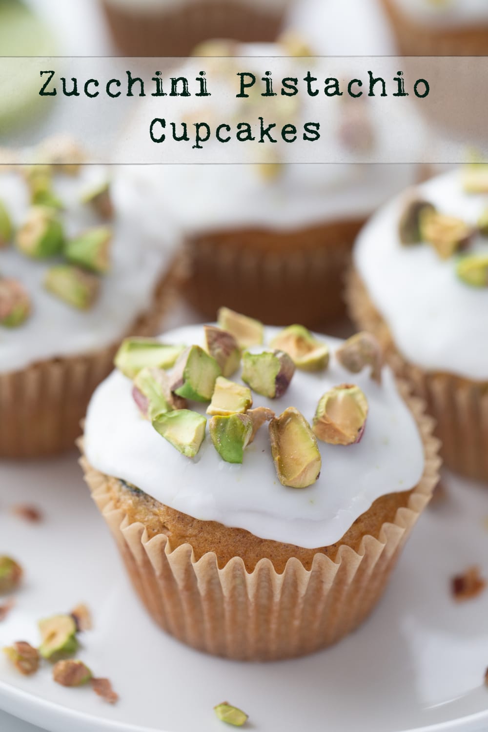 These zucchini pistachio cupcakes are an irresistible spiced dessert, topped with zingy lime icing and crunchy pistachios. You'll forget you're even eating your veggies! via @cmpollak1