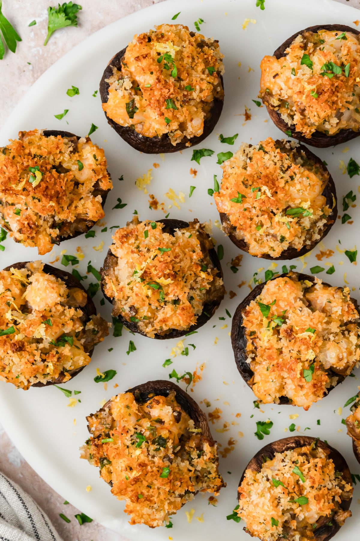 Baked shrimp stuffed mushrooms with golden Parmesan panko, parsley and lemon zest