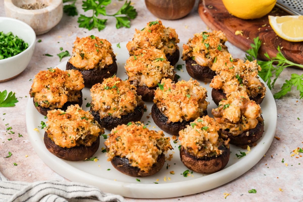 Platter of shrimp stuffed mushrooms topped with Parmesan panko, parsley and fresh lemon zest