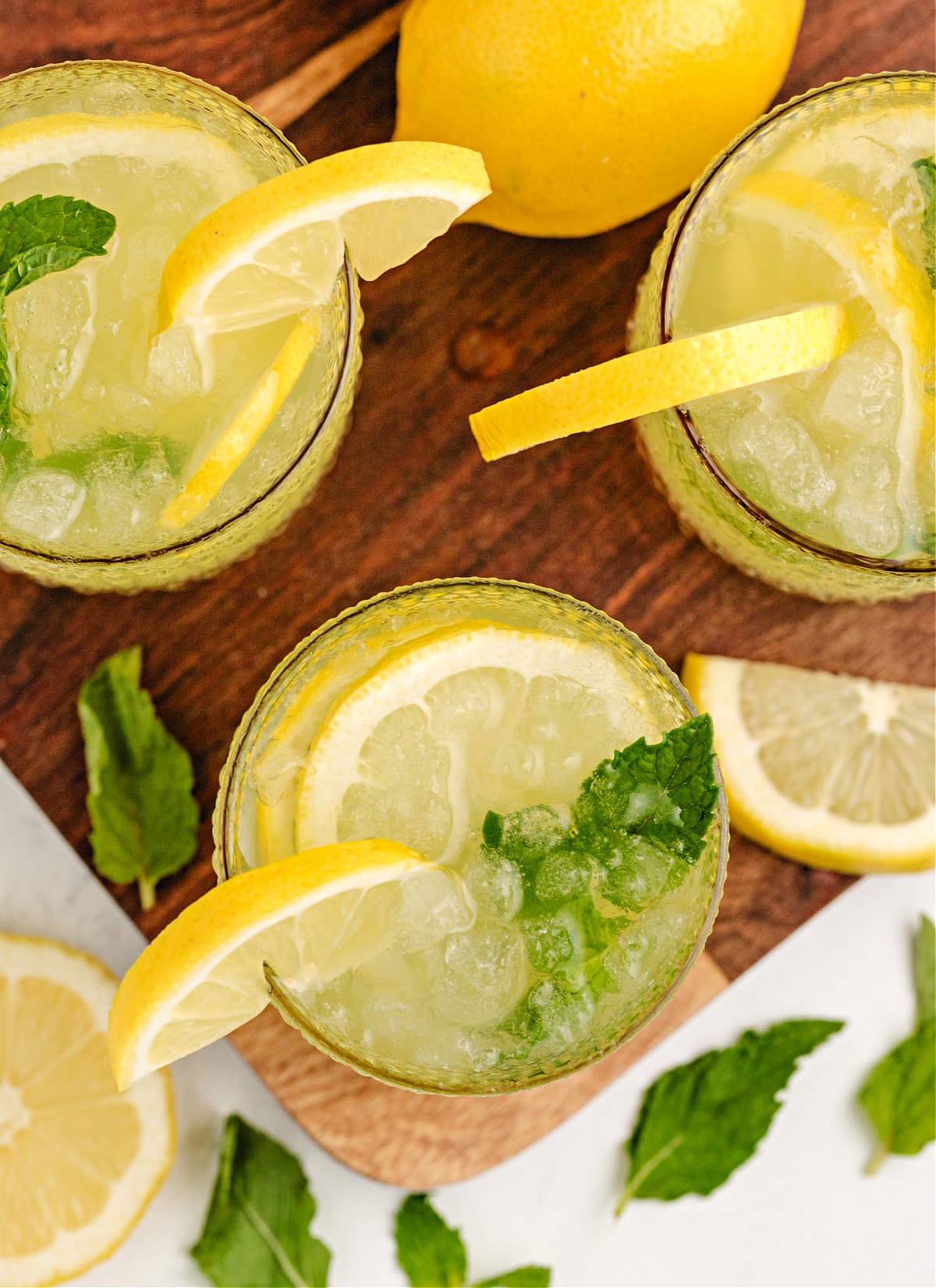 Italian lemonade cocktail topped with Pellegrino, garnished with mint and lemon slices