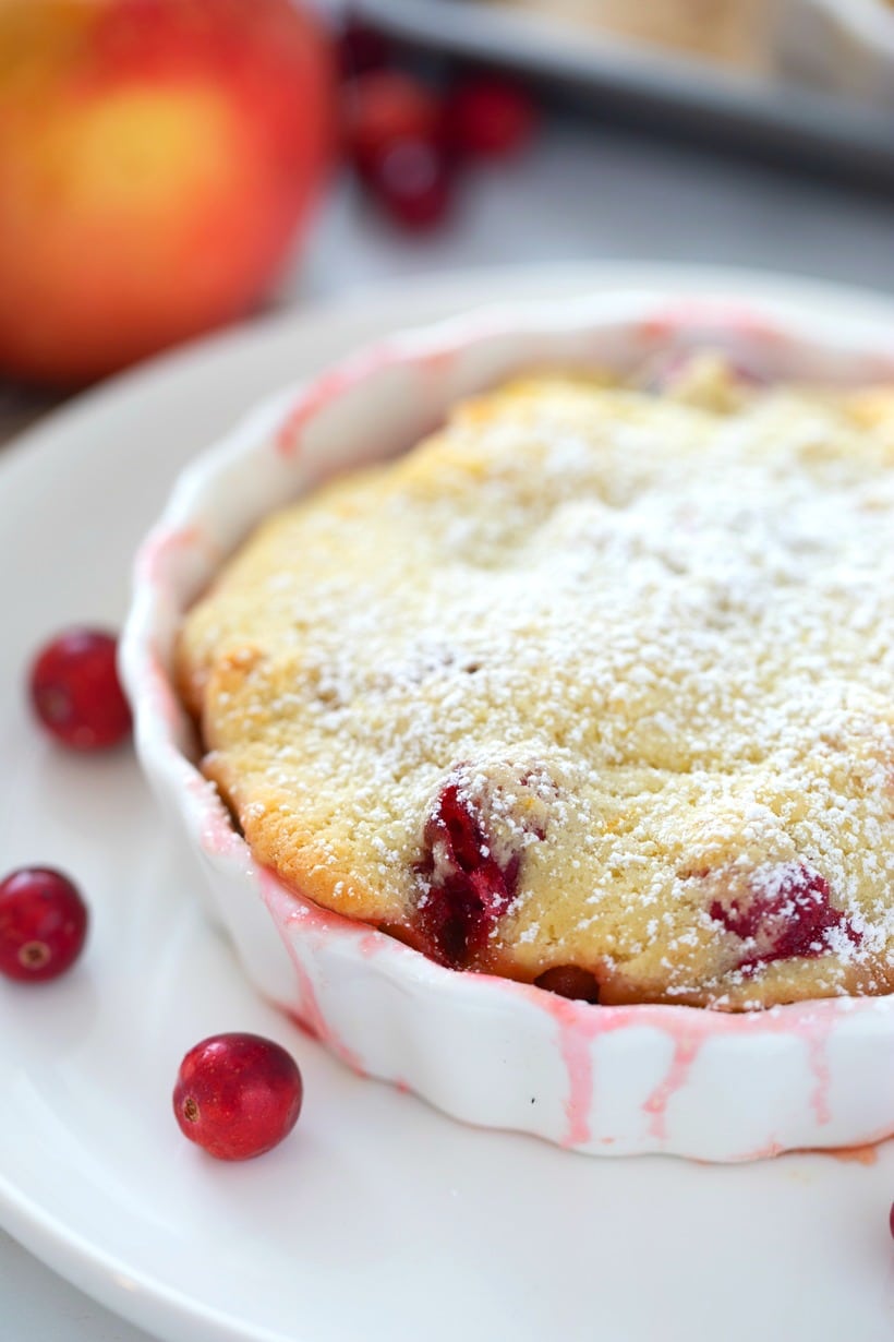 Individual cranberry apple cobbler in a white ramekin.