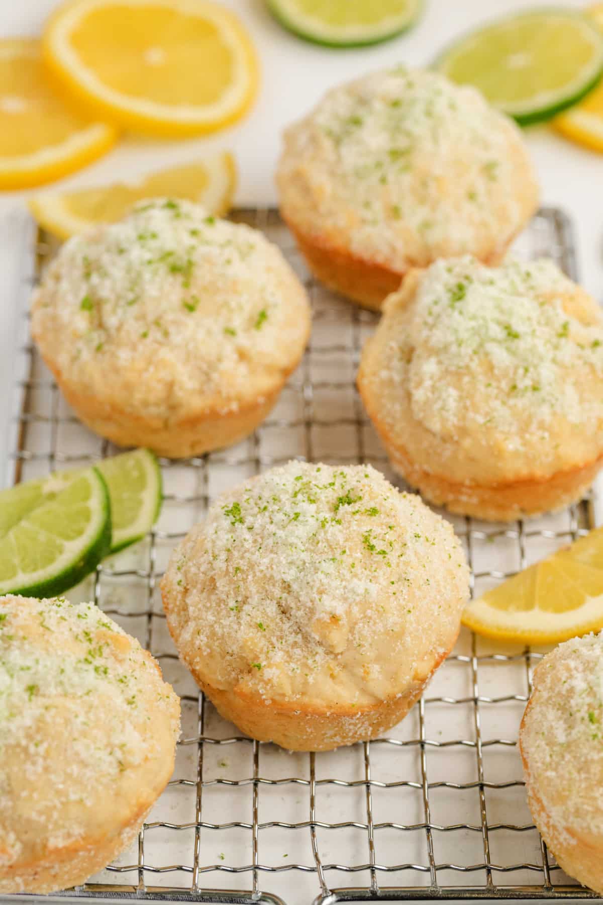 Lemon Muffins with Lime-Scented Sugar on a cooling rack Close up of lemon muffins with sugar coating on a cooling rack