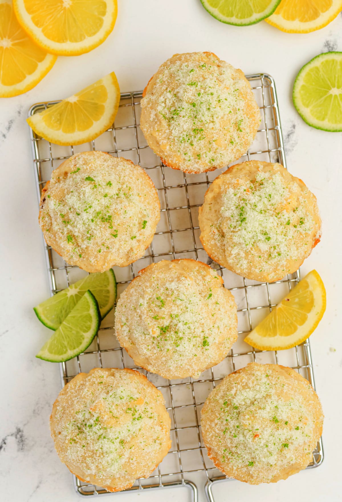 Lemon Muffins with Lime-Scented Sugar on a cooling rack Group of lemon muffins with lime-scented sugar arranged on a cooling rack with lime sugar scattered around