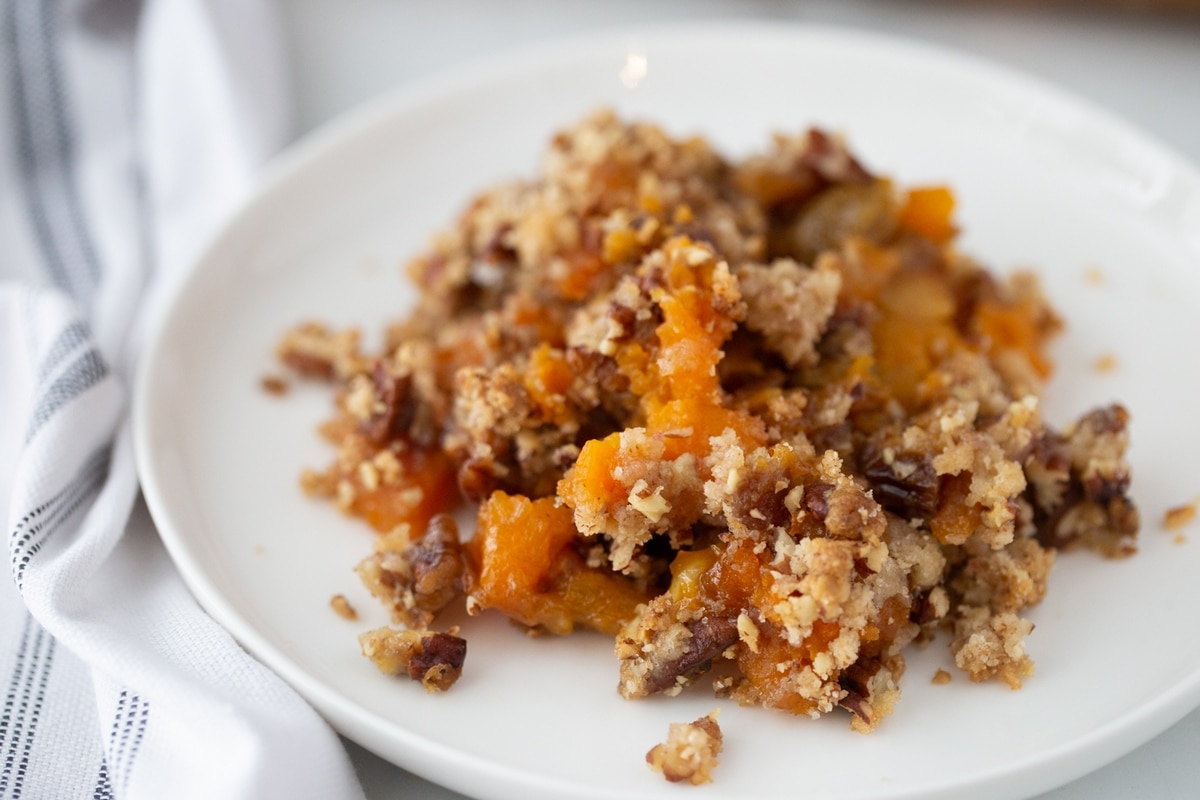 This streuseled sweet potato casserole is the ultimate holiday side, with a rich, creamy base and a crunchy streusel topping. Packed with add-ins, it’s perfect for every Thanksgiving table. sweet potato casserole