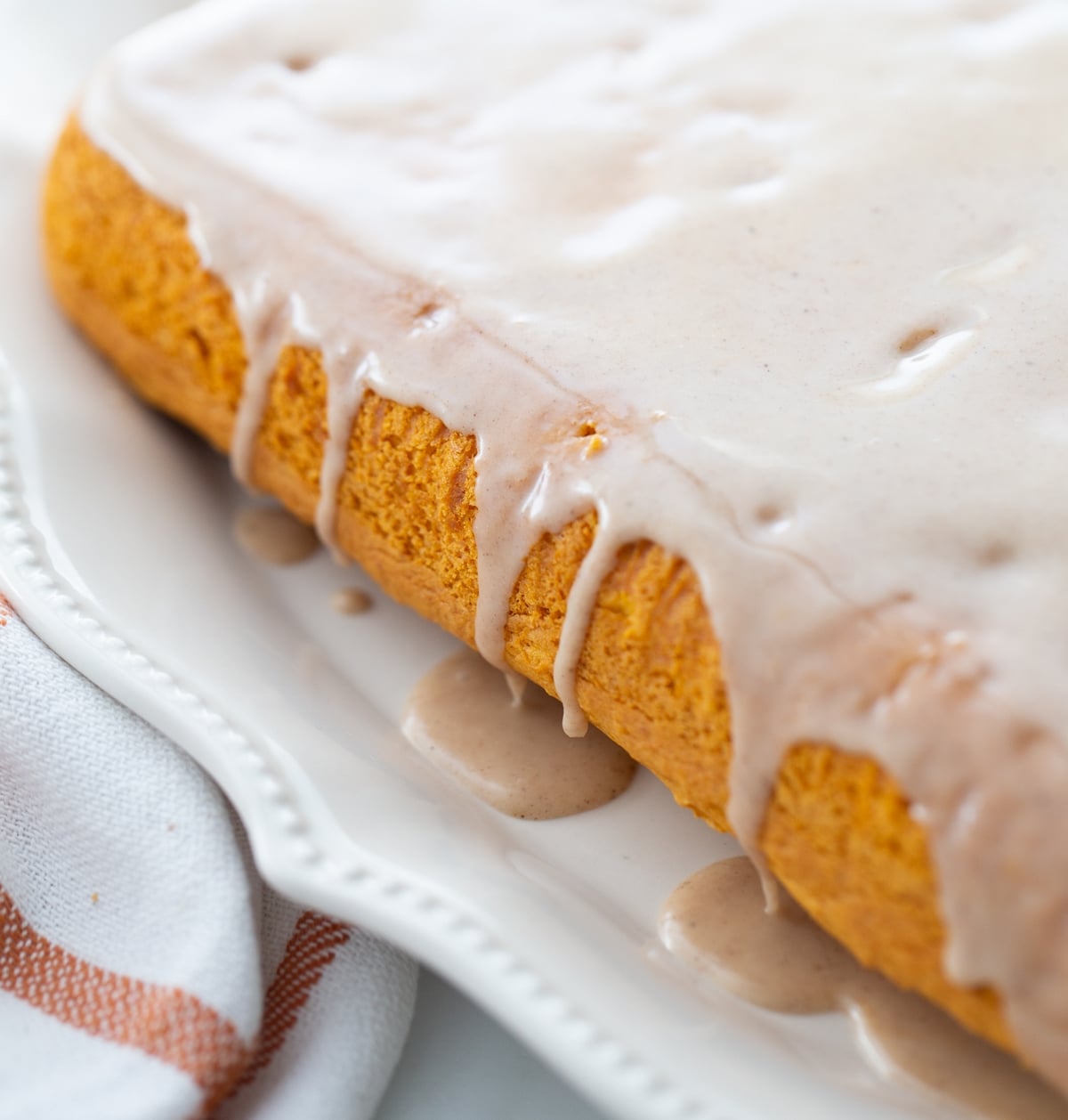This two-ingredient pumpkin cake is one of the easiest desserts to throw together, and it’s always a hit. The apple cider glaze on top adds just the right amount of sweetness to balance the rich pumpkin flavor. pumpkin cake with glaze
