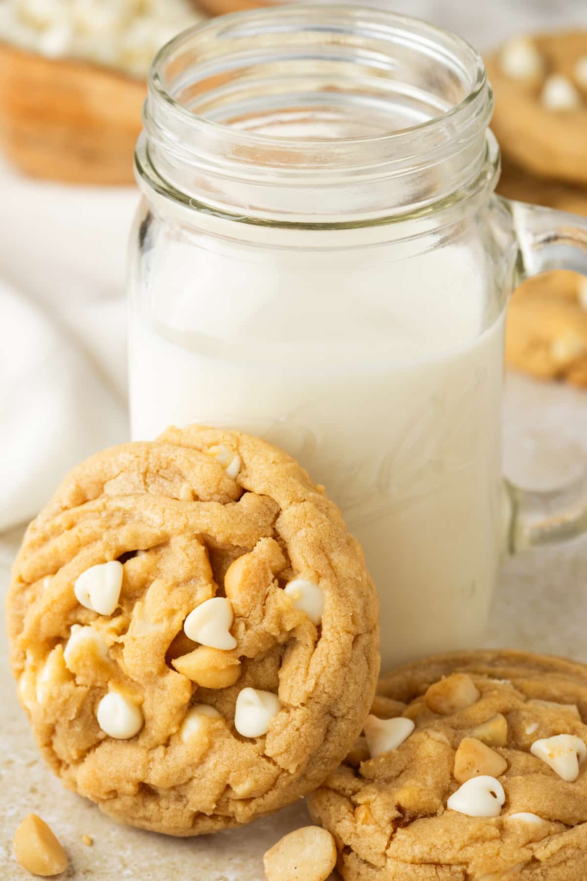 White Chocolate Macadamia Cookies with Milk white chocolate macadamia cookies served with milk showing soft texture and white chocolate chips