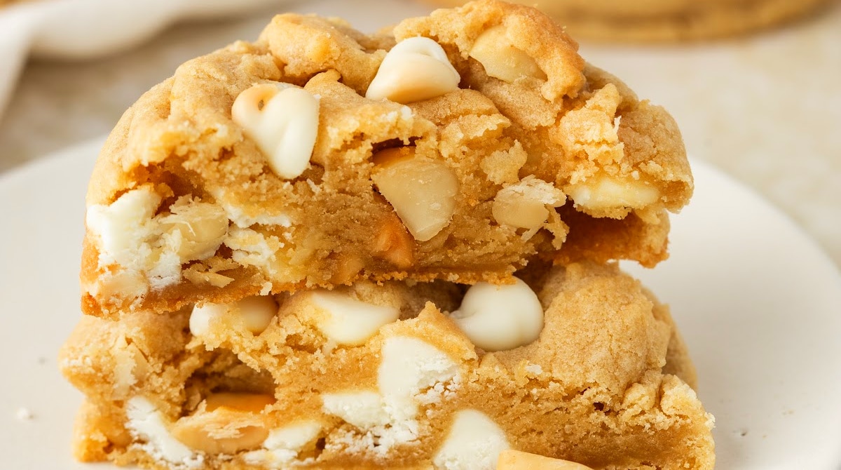White Chocolate Macadamia Nut Cookies Soft Center white chocolate macadamia nut cookies stacked thick and soft with white chocolate chips and macadamia nuts