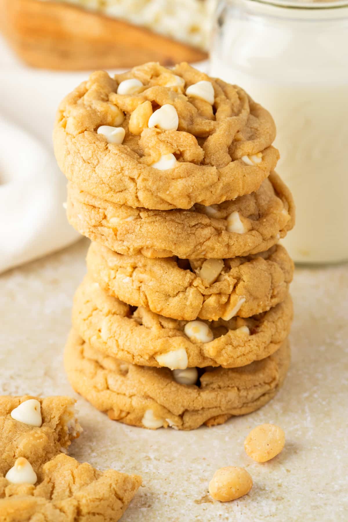 White Chocolate Macadamia Nut Cookies white chocolate macadamia nut cookies stacked thick and soft with white chocolate chips and macadamia nuts