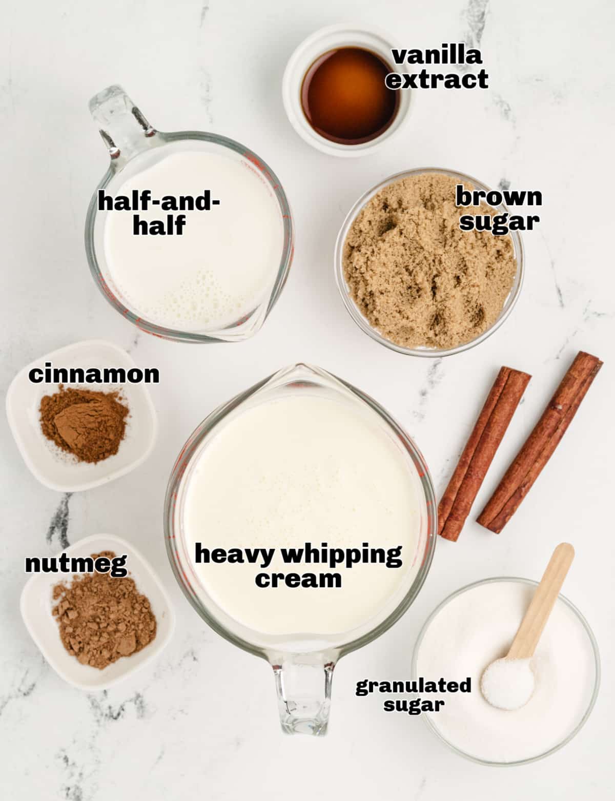 Measured ingredients for snickerdoodle ice cream on a white surface.