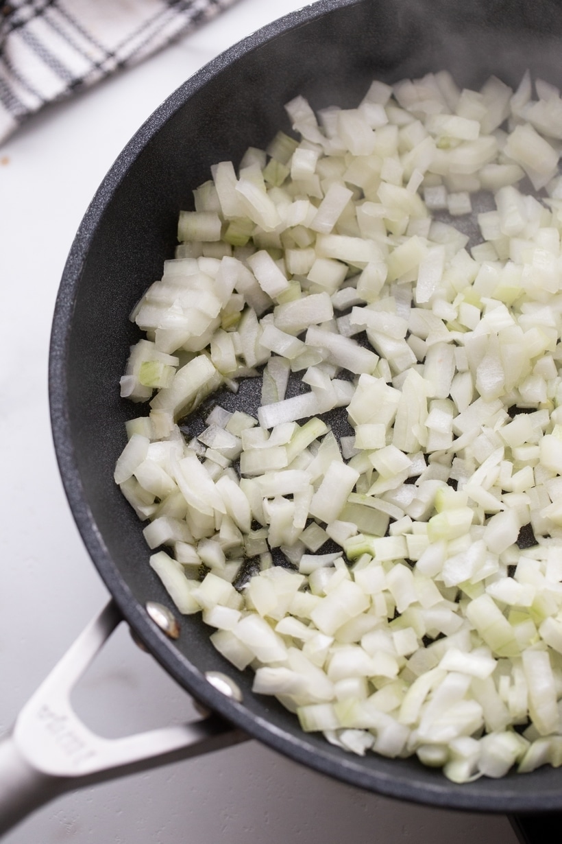 This mouthwatering blue cheese dip with caramelized onions, tastes like a delicious blend of French onion soup and blue cheese goodness. It's so addictive, you just might eat it with a spoon. It's one of the best! onions in a skillet