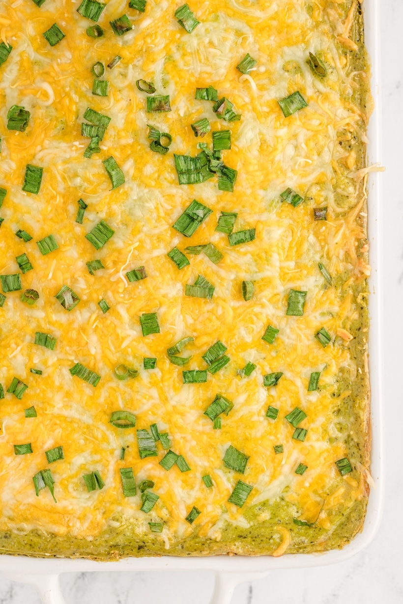 This Chicken Poblano Casserole brings together a creamy, roasted poblano sauce, juicy chicken, gooey cheeses and layers of tortillas that deliver an enchilada-inspired dinner creation you're going to love. This cheesy casserole effortlessly transitions from a comforting weeknight dinner to a show-stopping, flavor-packed dish for festive celebrations. chicken poblano casserole dinner