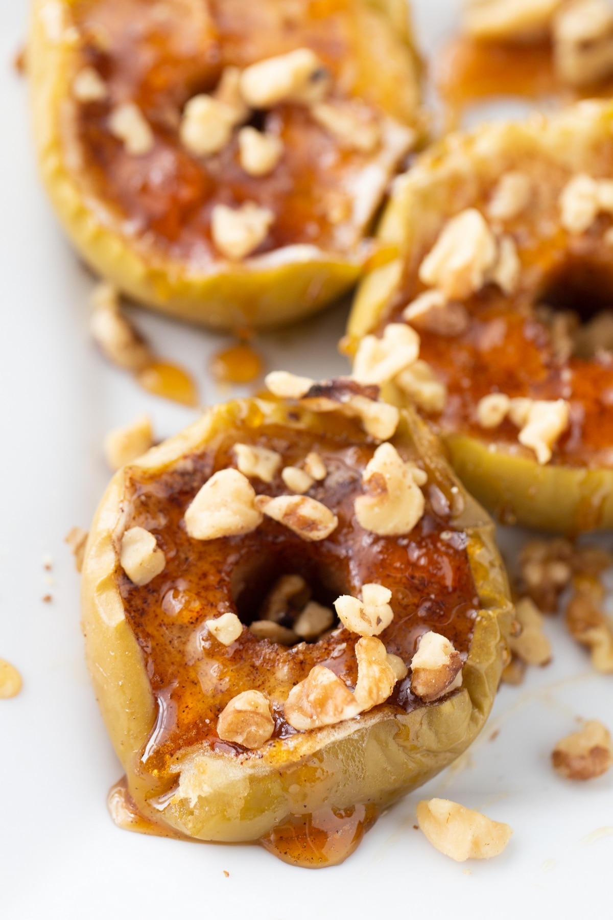 Baked Apples with Maple-Walnut Sauce is like a simpler version of apple pie, but just as satisfying. It's easy to throw together and always hits the spot. how to bake apples in the oven with a maple sauce