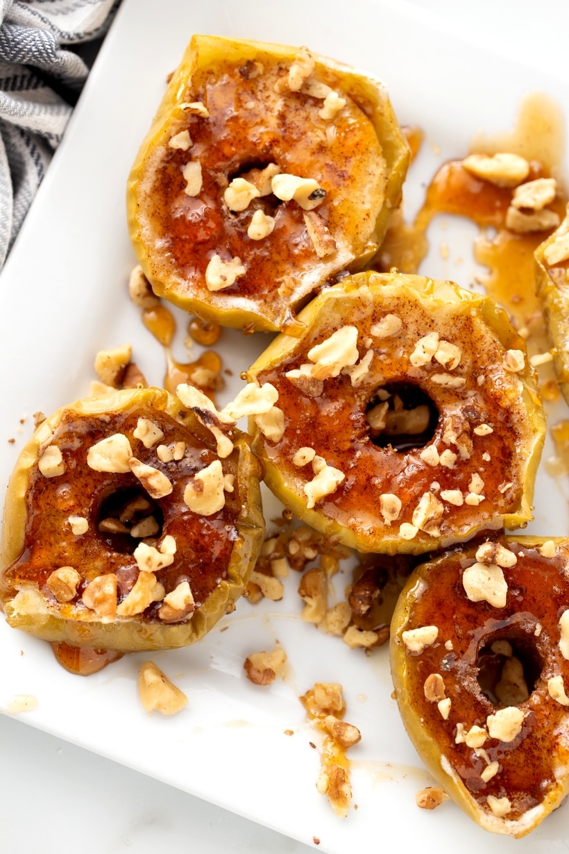 Baked Apples with Maple-Walnut Sauce is essentially apple pie without all the fuss. This baked apples recipe will have you looking forward to apple season every year. Finished baked apples