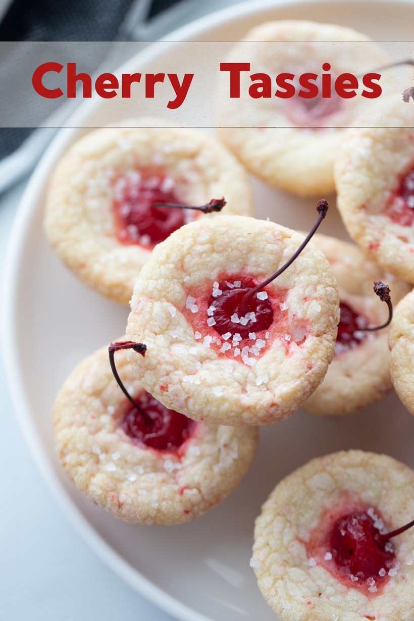 Long stemmed maraschino cherries burst right out the top of these pillowy-soft and bite-sized pastry pouch cookies. They are the perfect addition to any dessert table. tassie cups