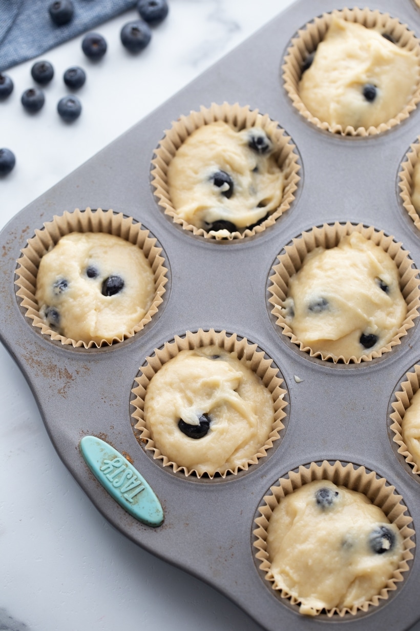 Sour cream blueberry muffins ready to bake in a muffin tin