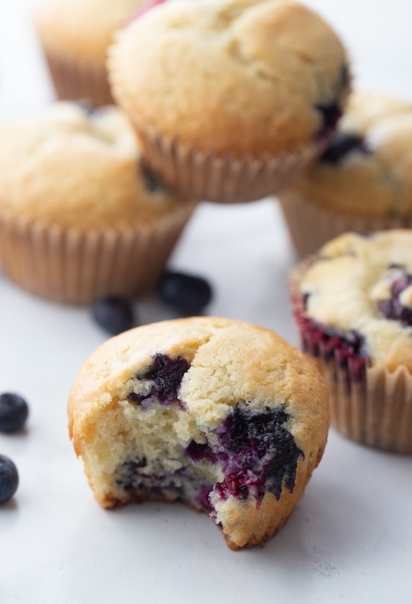 sour cream blueberry muffins one bite removed