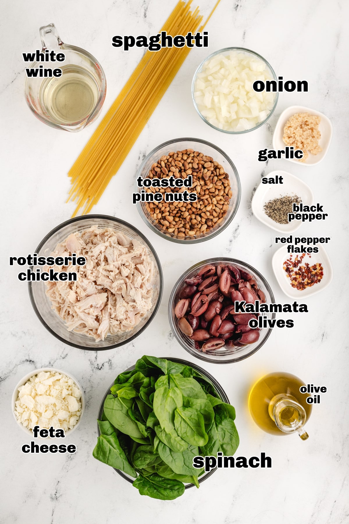 Greek Chicken Pasta ingredients. ingredients on a countertop