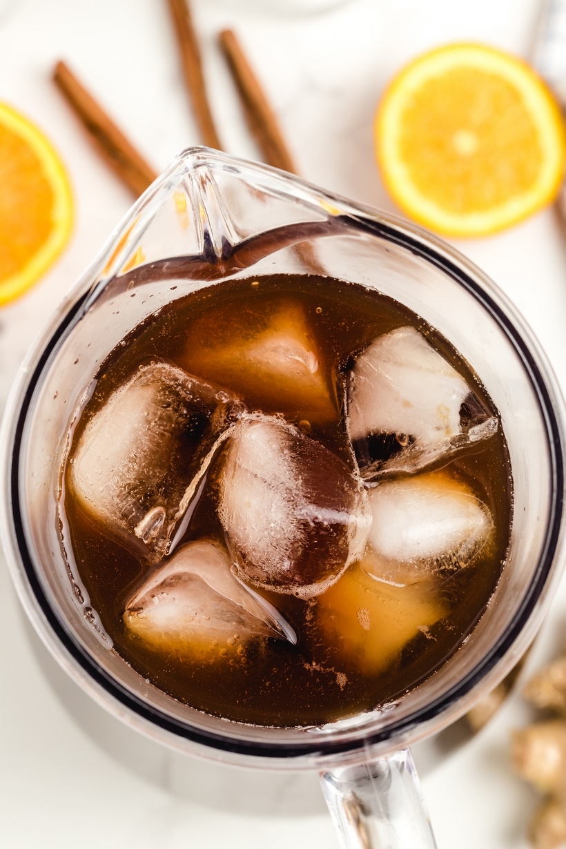 Cinnamon Orange Sweet Tea is not your typical backyard barbecue iced tea, it's so much better! This next level sweet tea uses cinnamon and ginger to highlight the sweetness of the added sugar and bring the citrus undertones to life! Ice tea in a pitcher