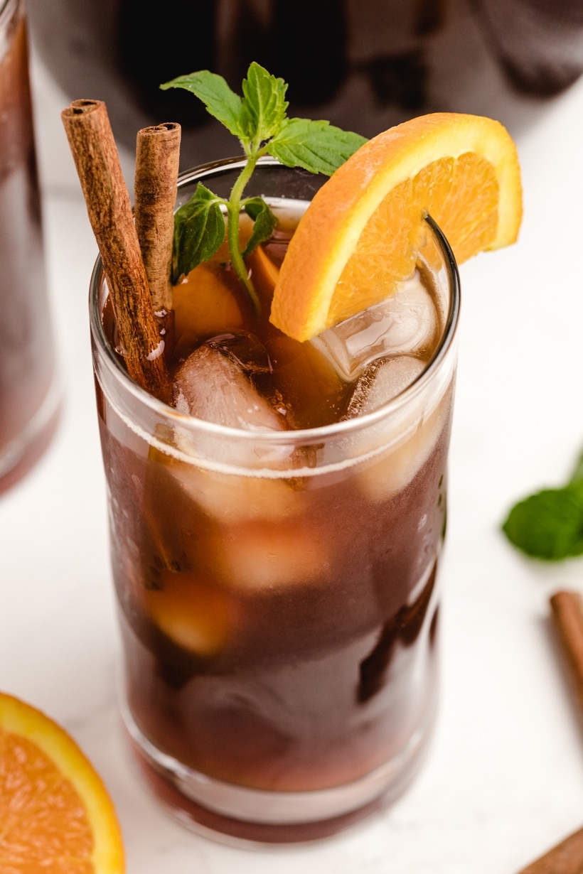 Cinnamon Orange Sweet Tea is not your typical backyard barbecue iced tea, it's so much better! This next level sweet tea uses cinnamon and ginger to highlight the sweetness of the added sugar and bring the citrus undertones to life! cinnamon orange sweet tea