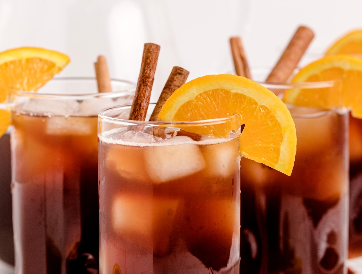 Cinnamon Orange Sweet Tea is not your typical backyard barbecue iced tea, it's so much better! This next level sweet tea uses cinnamon and ginger to highlight the sweetness of the added sugar and bring the citrus undertones to life! cinnamon orange iced tea