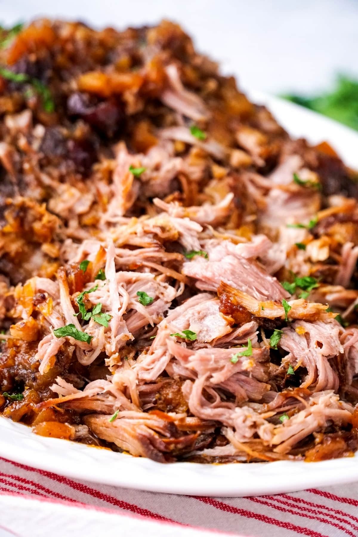 Pork with cranberry-pineapple sauce, served on a dish.