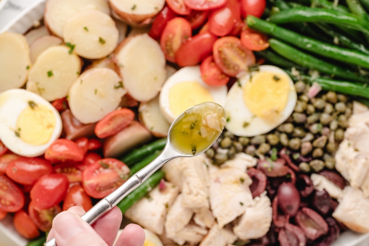 This chicken niçoise salad is one of my favorite full-meal salads. It has all the Mediterranean flair, and when paired with a baguette, it makes a complete dinner. The vinaigrette is distinctively delicious and can't be missed. chicken niçoise salad
