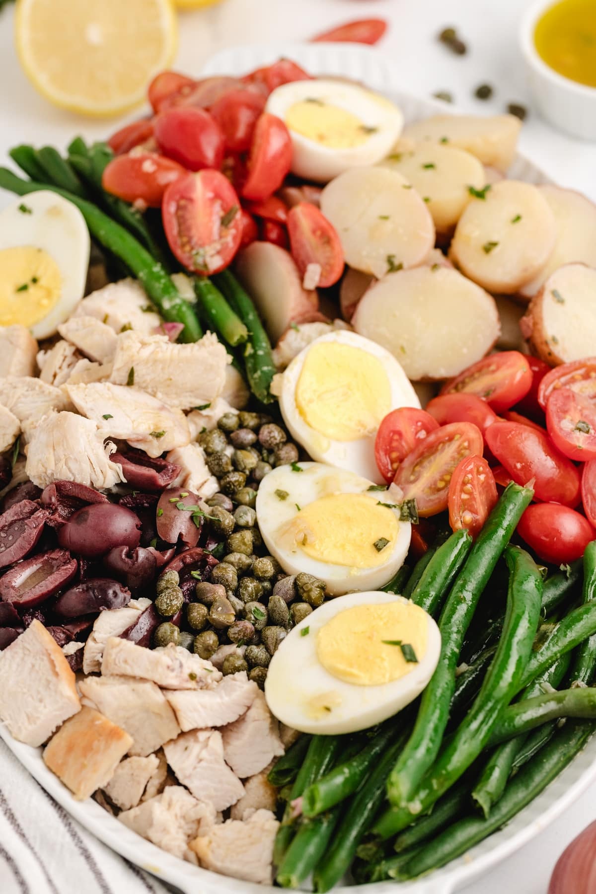 This chicken niçoise salad is one of my favorite full-meal salads. It has all the Mediterranean flair, and when paired with a baguette, it makes a complete dinner. The vinaigrette is distinctively delicious and can't be missed. niçoise salad