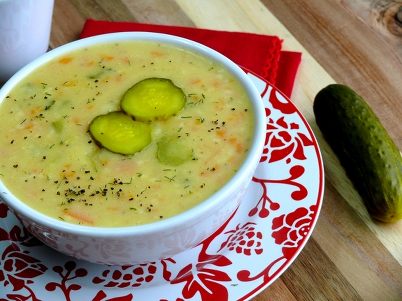 This recipe for Dill Pickle Soup has swept the nation! It will become a staple in your household. Soup with pickles on the table