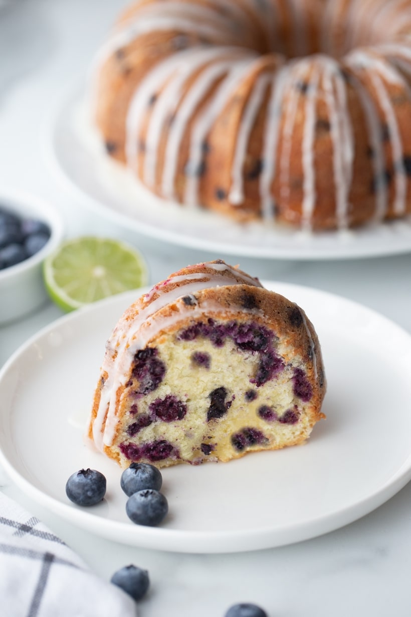 Blueberry pound cake drizzled with a tangy lime glaze – a zippy-sweet dessert, with an exceptionally tender and rich cake. An absolute flavor powerhouse! blueberry lime pound cake