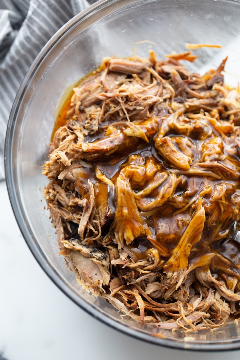 Rescuing your weeknight with a hassle-free slow-cooker masterpiece—truly a "set-it-and-forget-it" meal, with flavors that seem far more labor-intensive. This pulled pork, prepared in just 10 minutes, is the ultimate comfort food dinner idea. Perfect for pulled pork slow cooker and crock pot enthusiasts and those seeking easy dinner ideas. Enjoy on your preferred soft or crusty bun for a satisfying pulled pork sandwiches experience. Pulled pork with sauce.