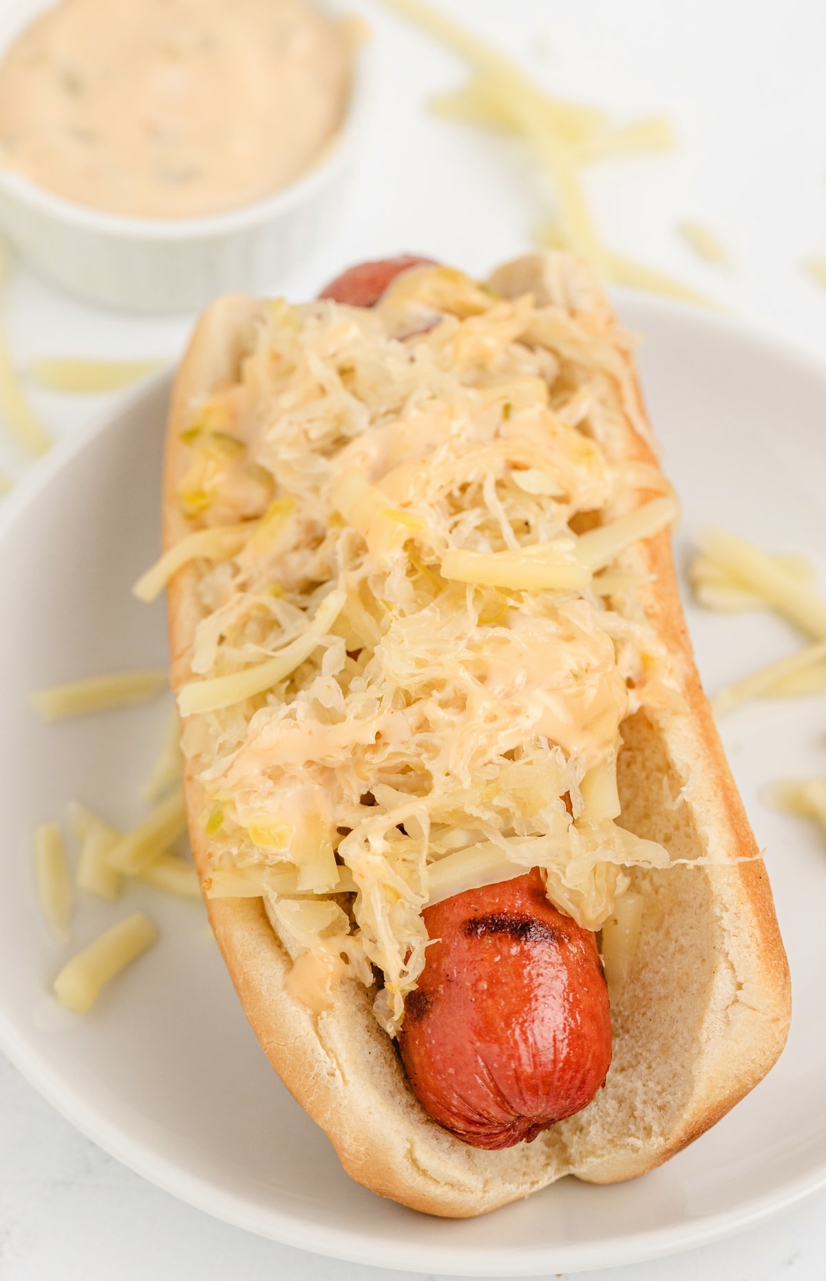 Hosting a hot dog bar has always been a fun way for me to showcase that my taste for hot dogs extends far beyond just mustard and ketchup. I love experimenting with interesting and unique toppings, and I think you'll be pleasantly surprised by how delicious these unconventional hot dogs can be. Reuben Dog