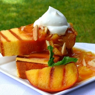 Grilled pound cake with grilled peaches and chantilly cream.