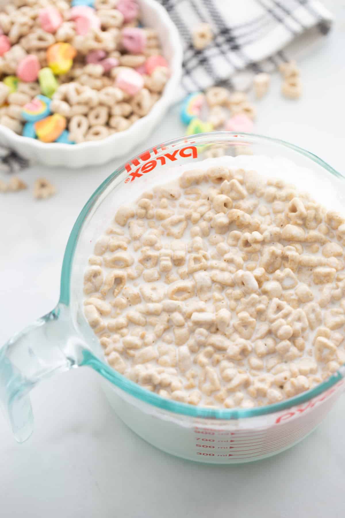 Lucky Charms Ice Cream cereal and milk A close-up of cereal soaking in the milk and cream mixture, softening and releasing its flavor.