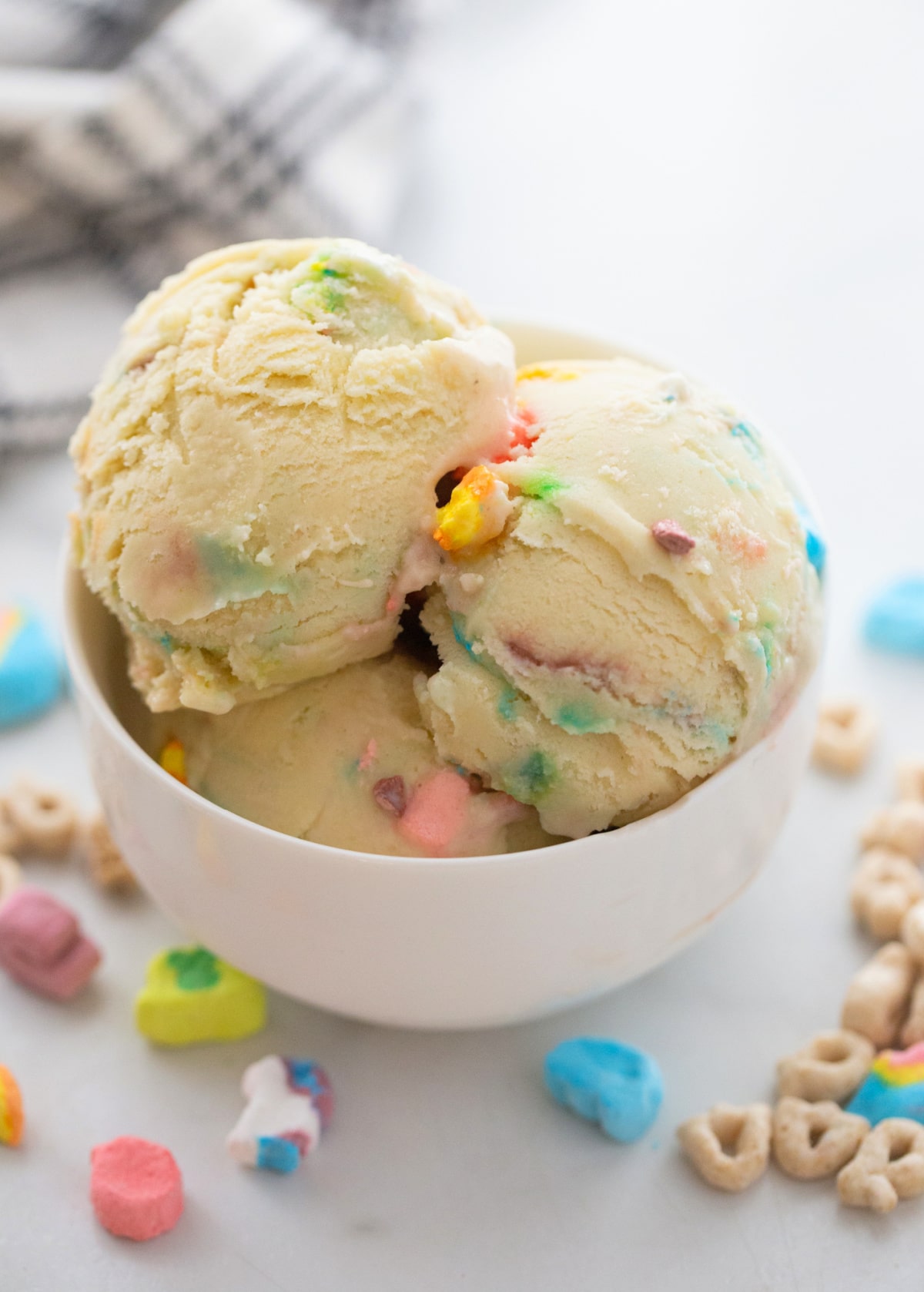 Lucky Charms Ice Cream for St. Patrick's Day A bowl of Lucky Charms Ice Cream with scoops piled high, featuring colorful marshmallows and a creamy texture.