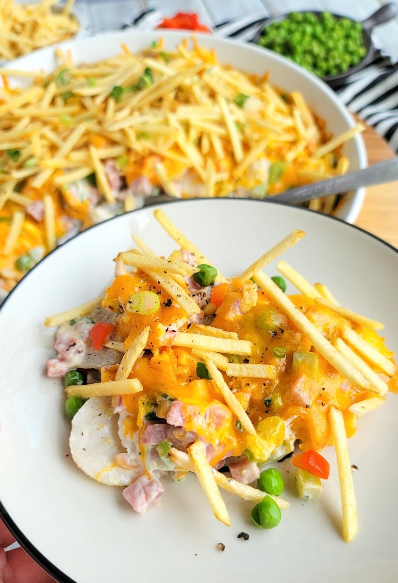 Ham and Cheese Casserole with Crunchy Topping served on a plate Single portion of the casserole on a plain white plate, showing the creamy interior and crispy topping.