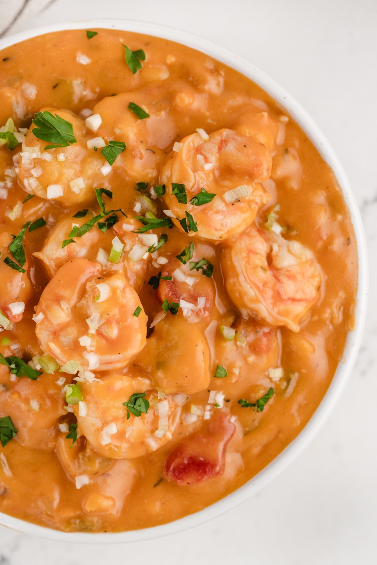 Creamy Shrimp Creole Soup with Bacon-Cornmeal Dumplings overhead view