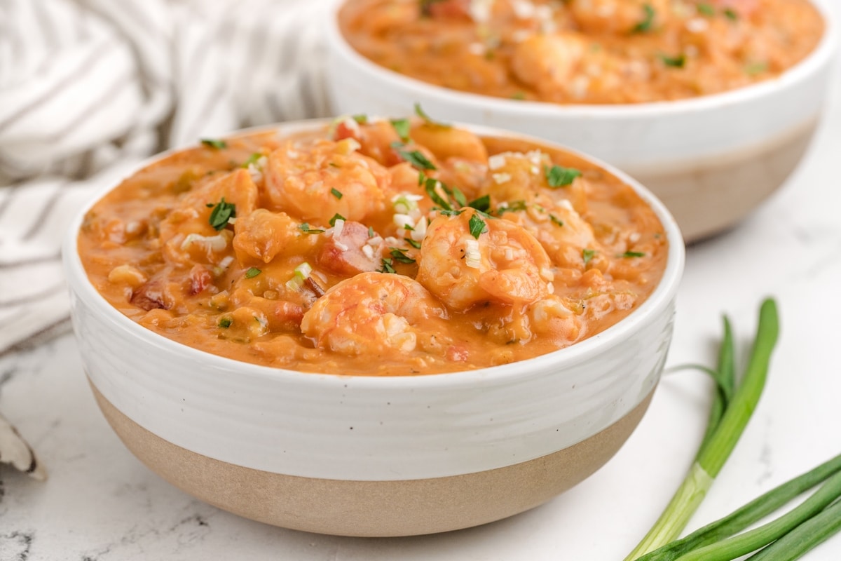 two bowls of Creamy Shrimp Creole Soup with Bacon-Cornmeal Dumplings